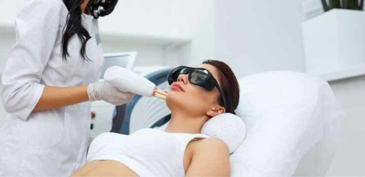 woman getting microdermabrasian treatment||woman getting microdermabrasian treatment